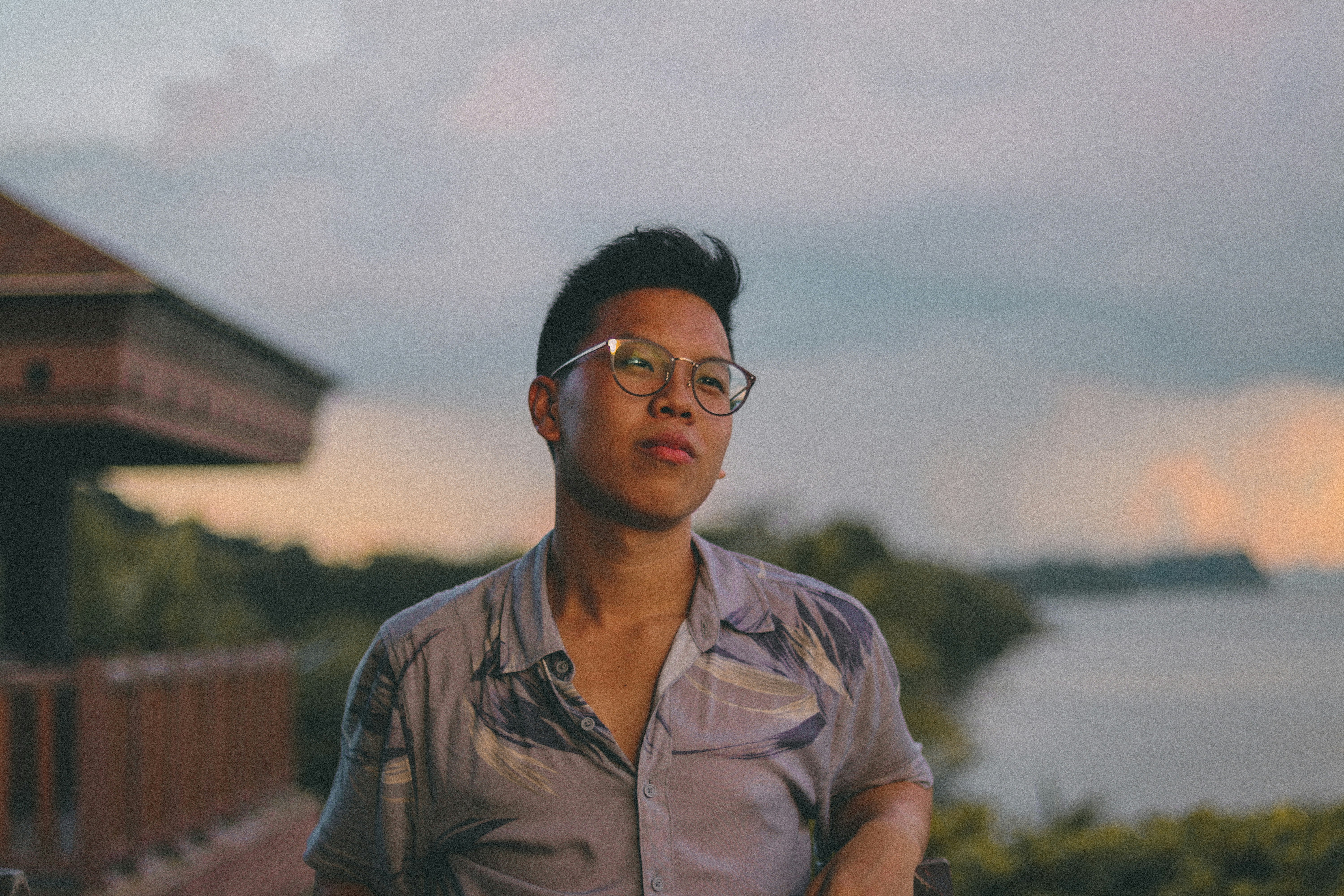 man in brown button up shirt wearing black framed eyeglasses